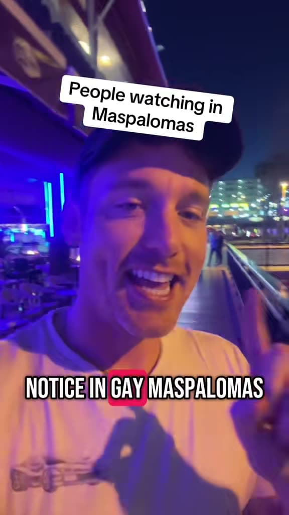 Christopher Adams on a seafront at night; the title card reads People watching in Maspalomas