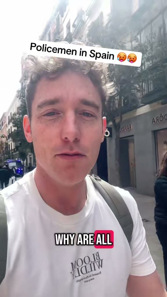 Christopher Adams on a street in Spain; the title card reads Policemen in Spain