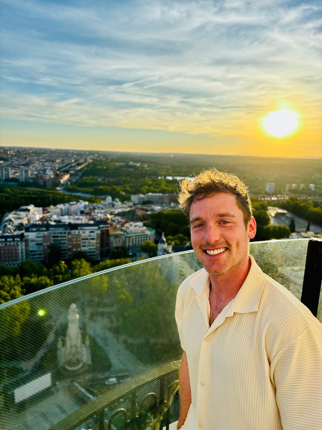 Christopher Adams on a rooftop above Madrid at sunset